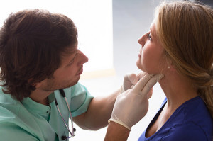 woman getting a check up by a doctor